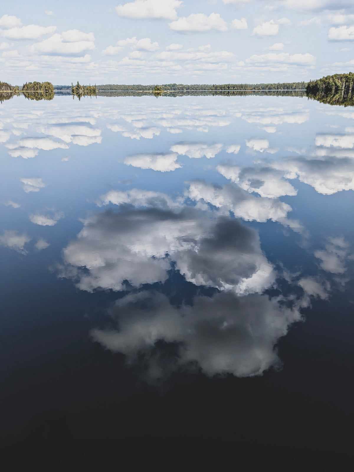Reflections of cloud in a lake
