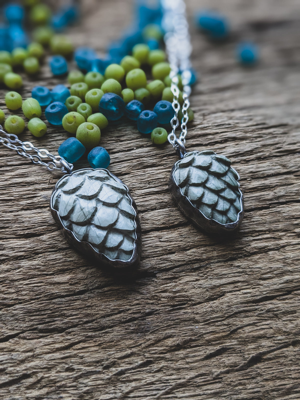 carved stone pinecone set in sterling silver